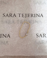 Anillo áurea de oro blanco y amarillo de 18K con diamante